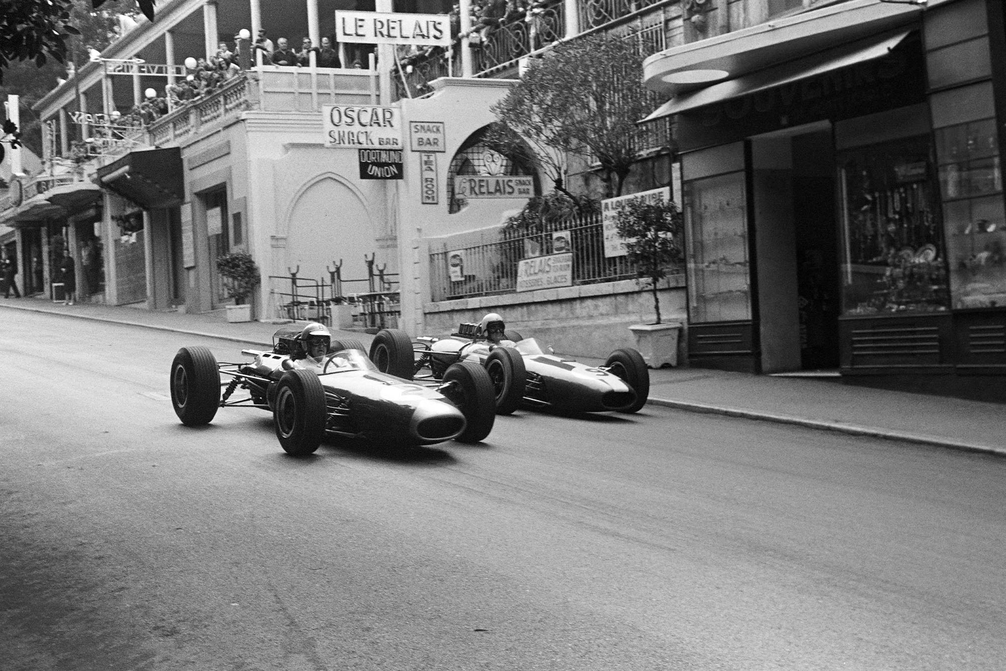 Denny Hulme, Brabham BT7 Climax, battles with Bob Anderson, Brabham BT11 Climax.