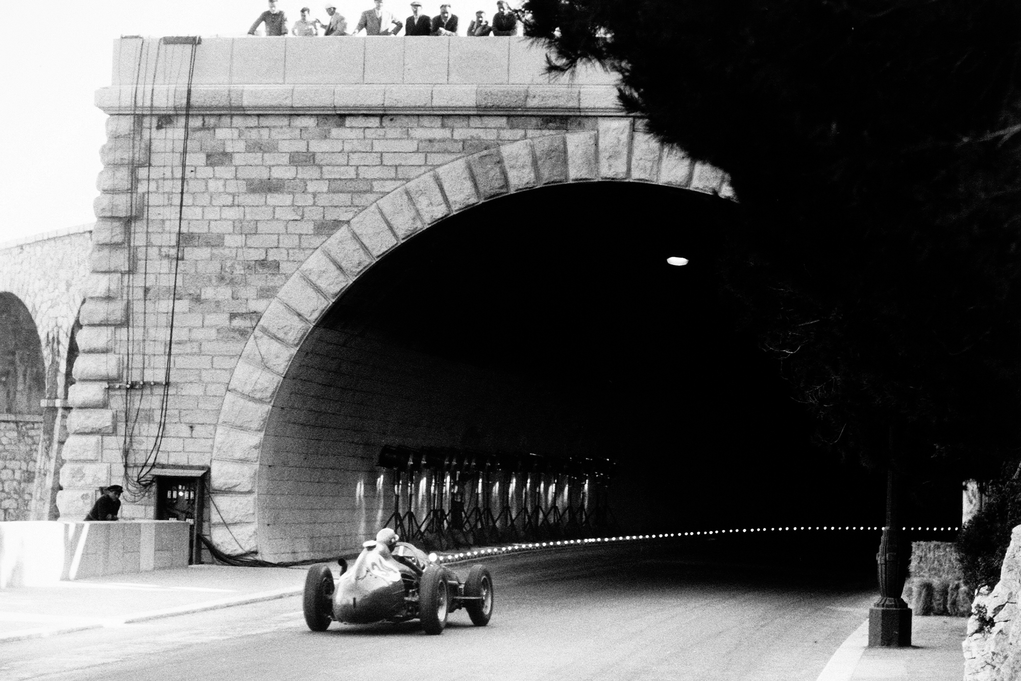 Luigi Musso heads into the tunnel in the Ferrari Dino 246 at the 1958 Monaco GP