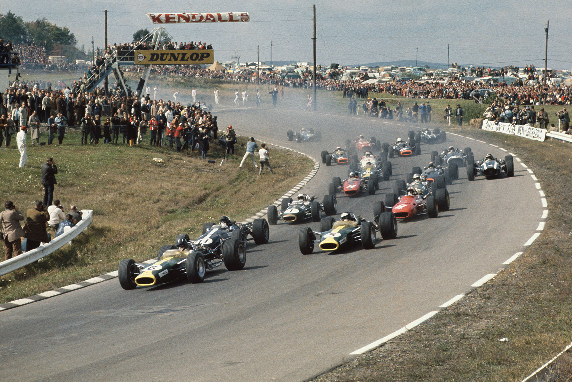 Watkins Glen, New York, USA. 30/9-1/10 1967. .At the start Graham Hill (Lotus 49 Ford) leads from Dan Gurney (Eagle T1G Weslake), Jim Clark (Lotus 49 Ford), Chris Amon (Ferrari 312), Jack Brabham and Denny Hulme (Brabham BT24-Repco), Bruce McLaren (McLaren M5A BRM), Jackie Stewart, Jochen Rindt, Moises Solana, Jo Siffert, John Surtees, Mike Spence, Chris Irwin, Jo Bonnier, Jacky Ickx, Guy Ligier and Jean-Pierre Beltoise.