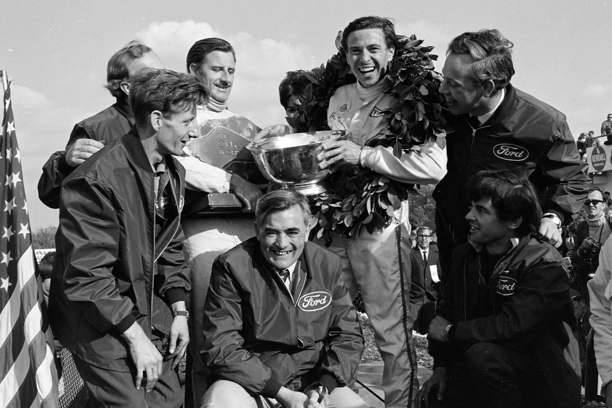 The Lotus team celebrate on the podium