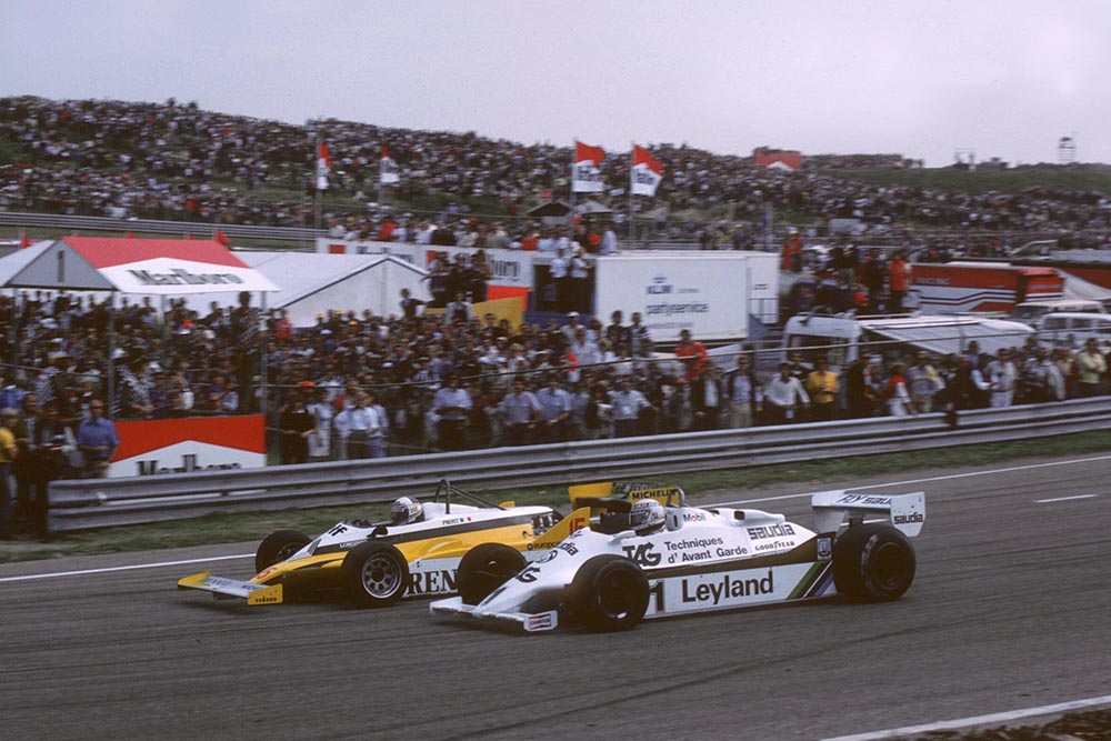 Winner Alain Prost Renault RE30, dives inside Alan Jones Williams FW07, to take the lead.