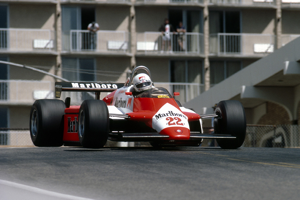 Andrea de Cesaris gets big air in his Alfa Romeo 182.
