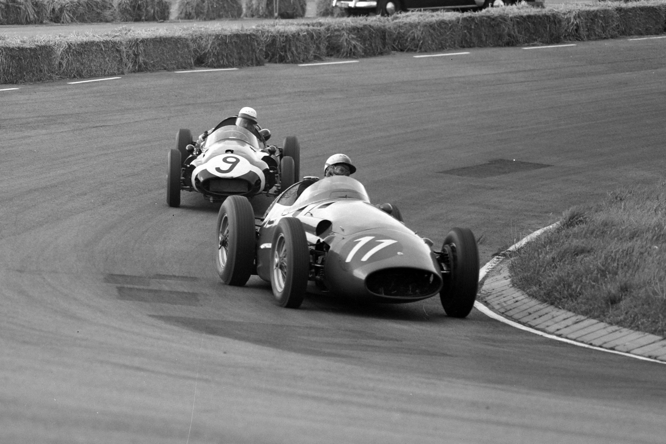 Jo Bonnier driving a Maserati 250F, leads Maurice Trintignant in his Cooper T45 Climax.