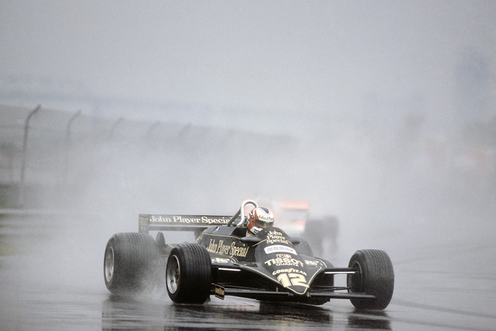 Nigel Mansell in a Lotus 87-Ford Cosworth, he later retired.