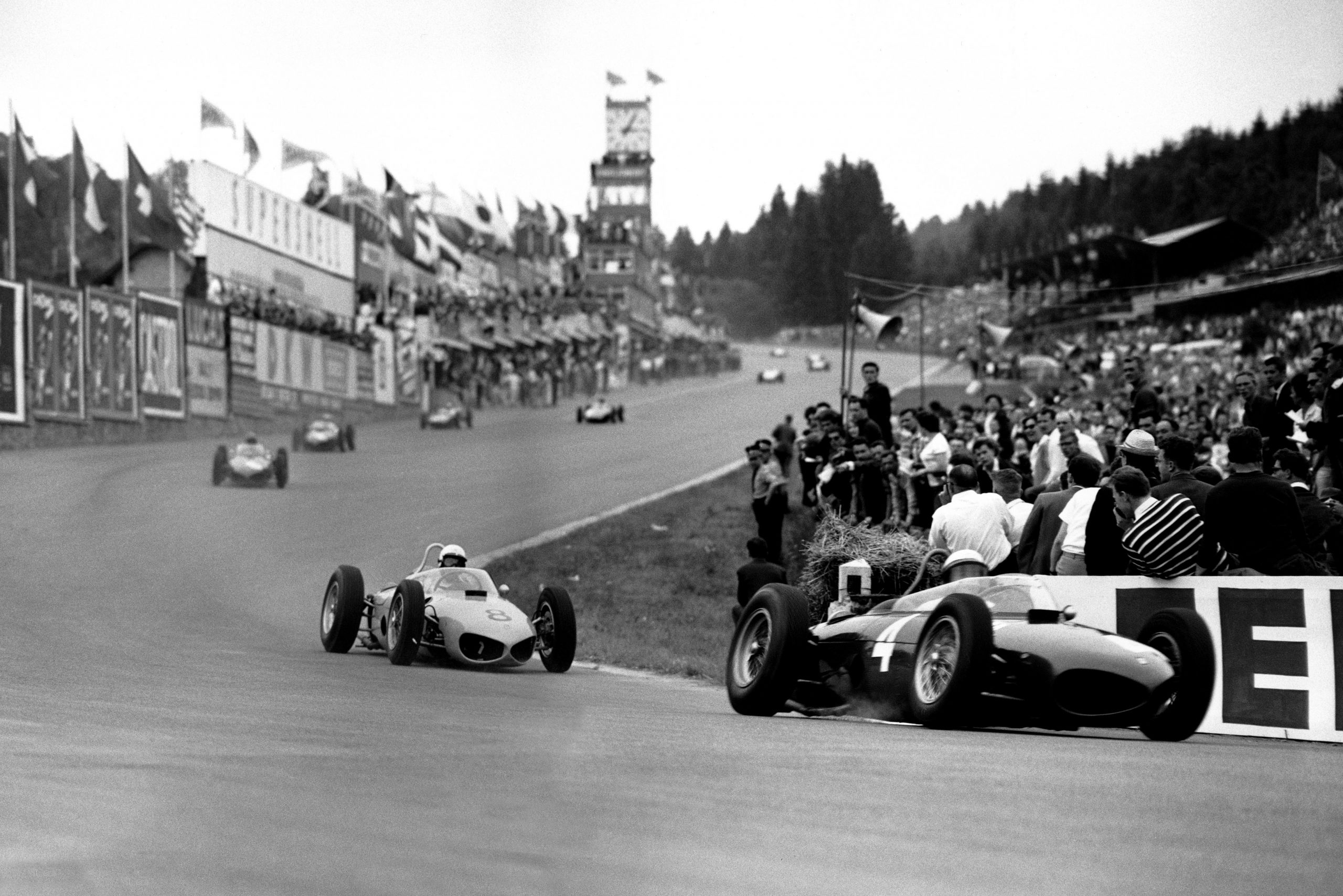 Phil Hill leads Olivier Gendebien, both in Ferrari 156s.