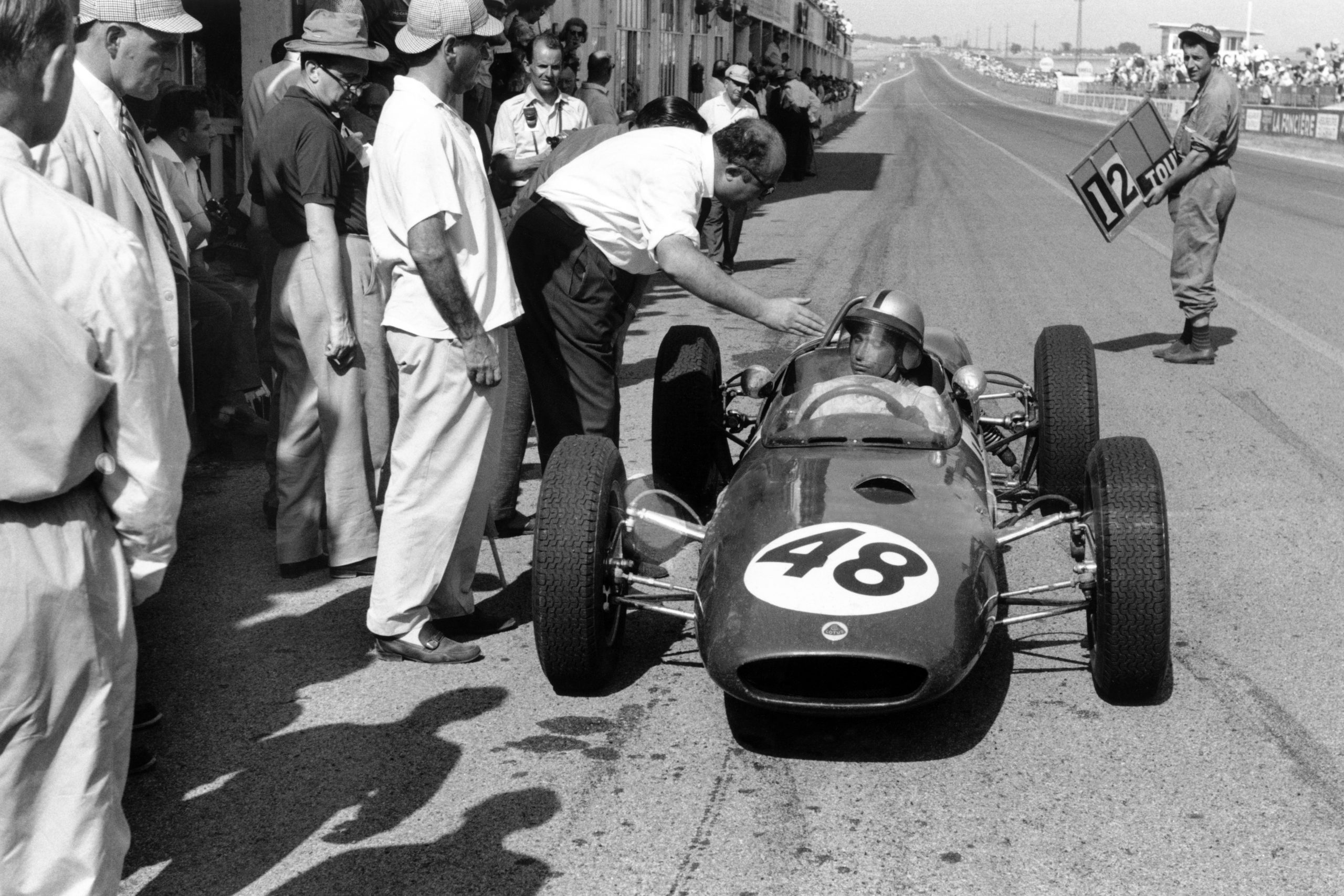 Willy Mairesse's Lotus 21-Climax in the pits.
