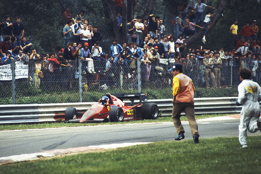 Marshals run to the assistance of Patrick Tambay after a spin.
