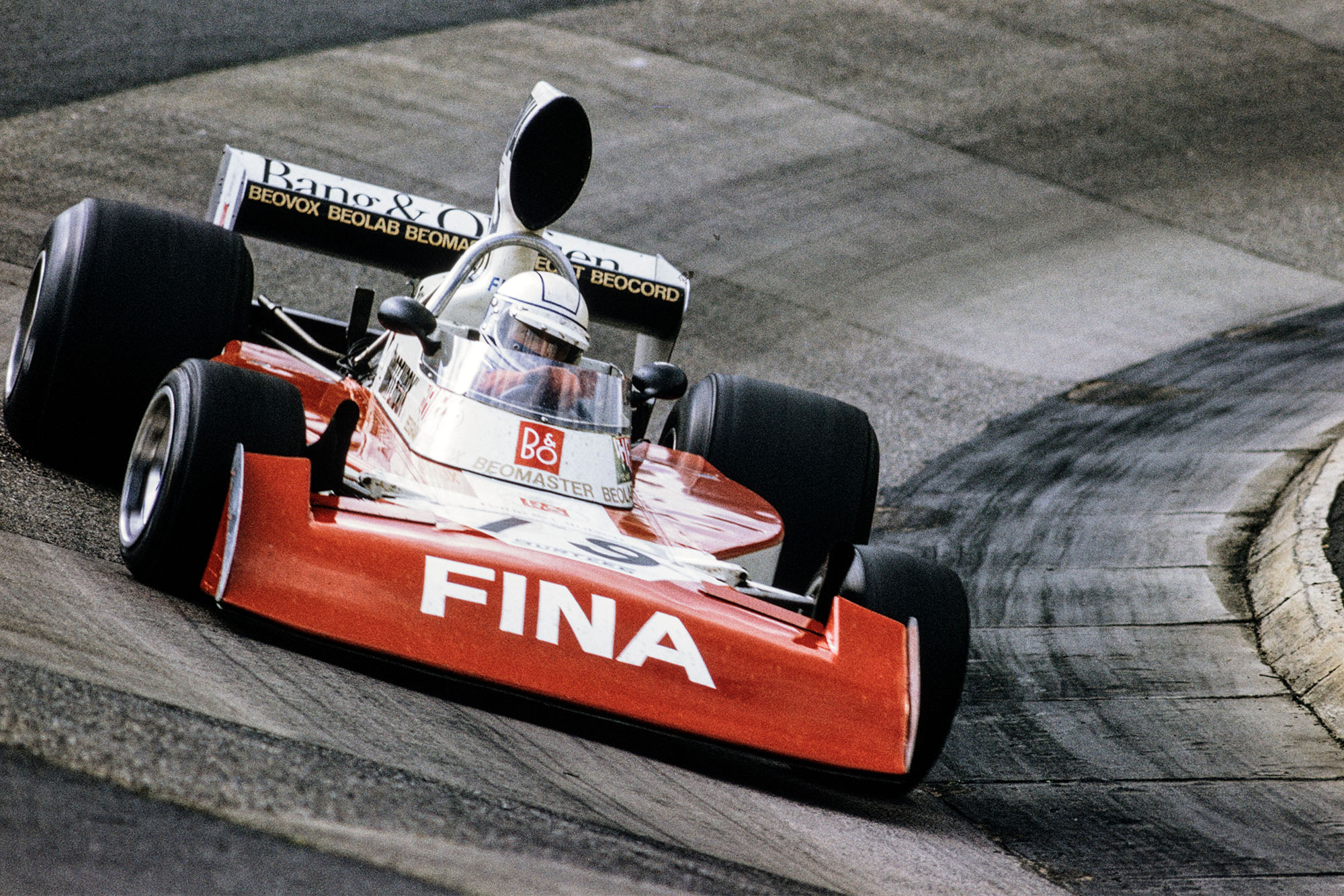 Jochen Mass drives through the Karussell in his Surtees at the 1974 German Grand Prix, Nurburgring.