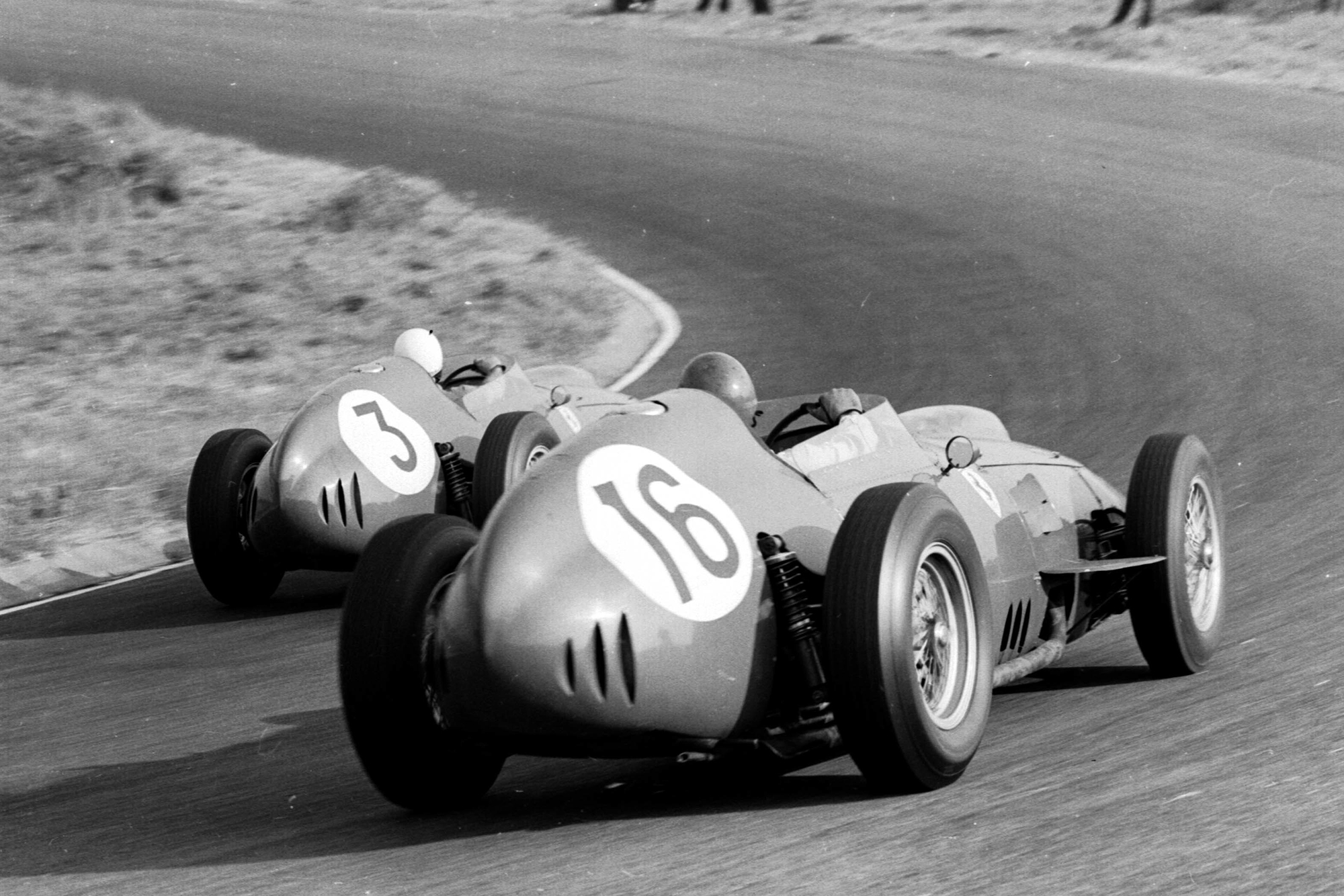 Phil Hill leads Cliff Allison, both driving Ferrari Dino 246's.