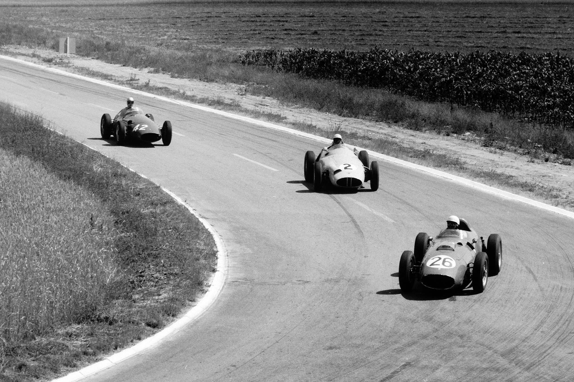 Phil Hill in a Ferrari Dino 246 leads Stirling Moss in his BRM P25 and Carel Godin de Beaufort's Maserati 250F.