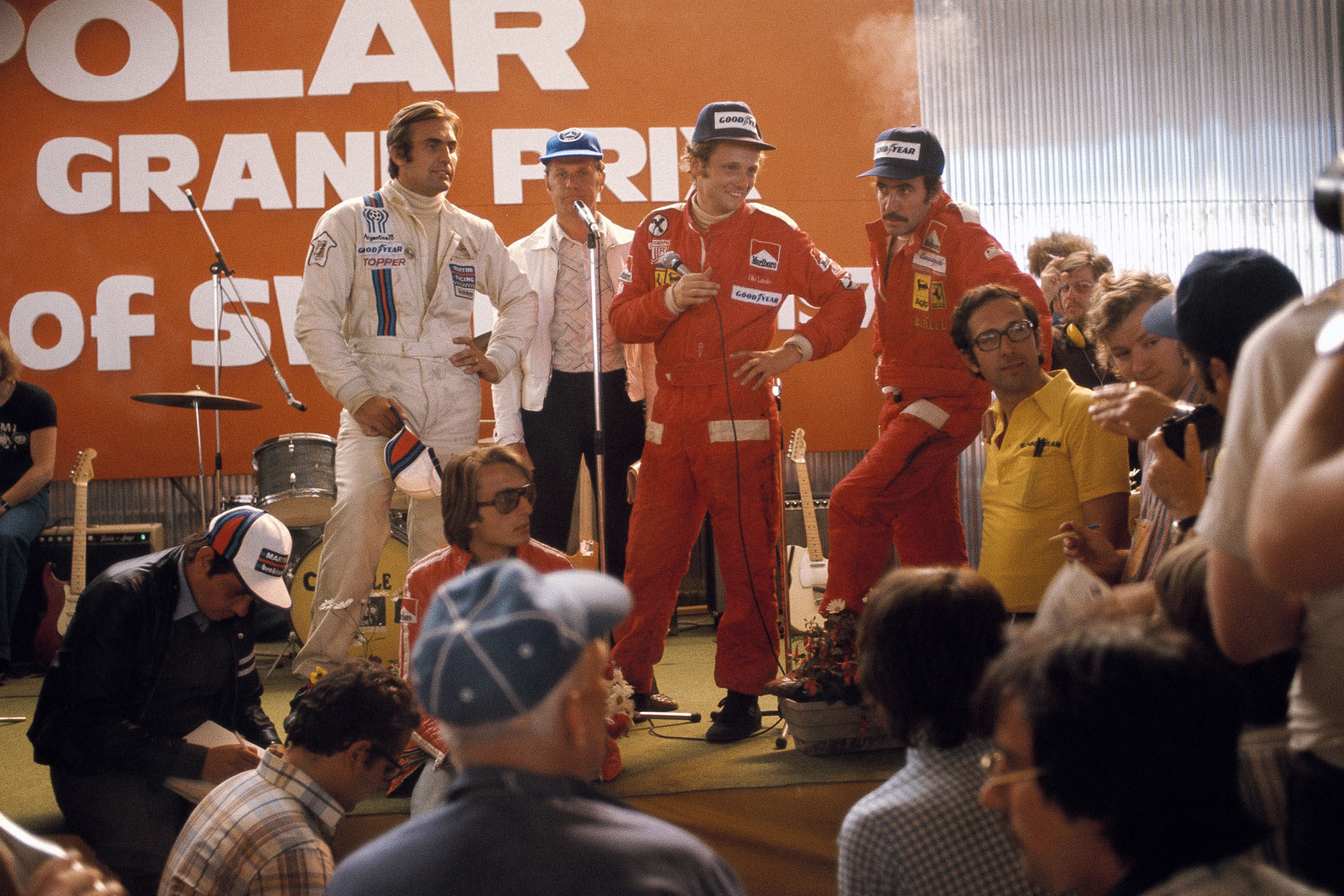 Niki Lauda (centre) faces the press at the end of the 1975 Swedish Grand Prix, Anderstorp.