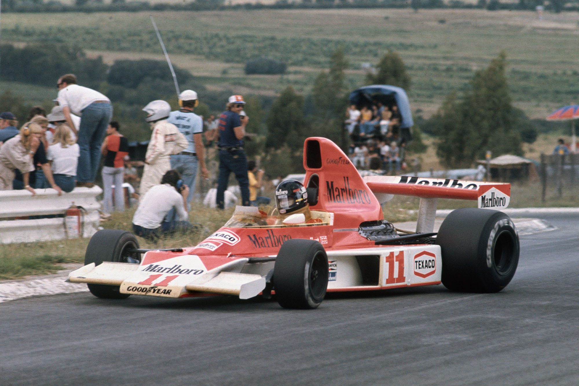 James Hunt (McLaren) dealing with oversteer at the South African Grand Prix, Kyalami.
