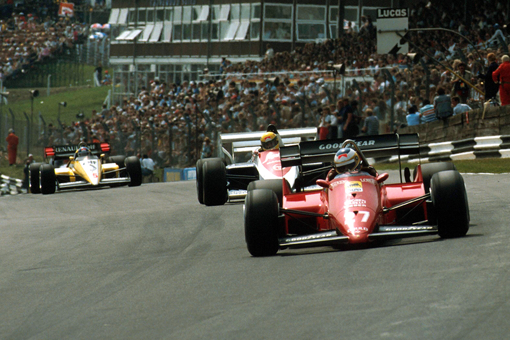 Michele Alboreto (Ferrari 126C4) leads Ayrton Senna (Toleman TG184).