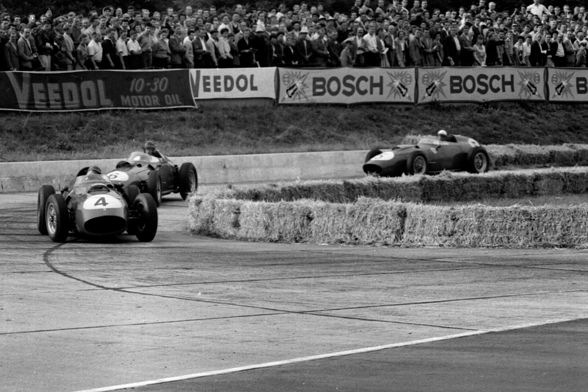Tony Brooks in a Ferrari Dino 246 leads into the Hairpin.