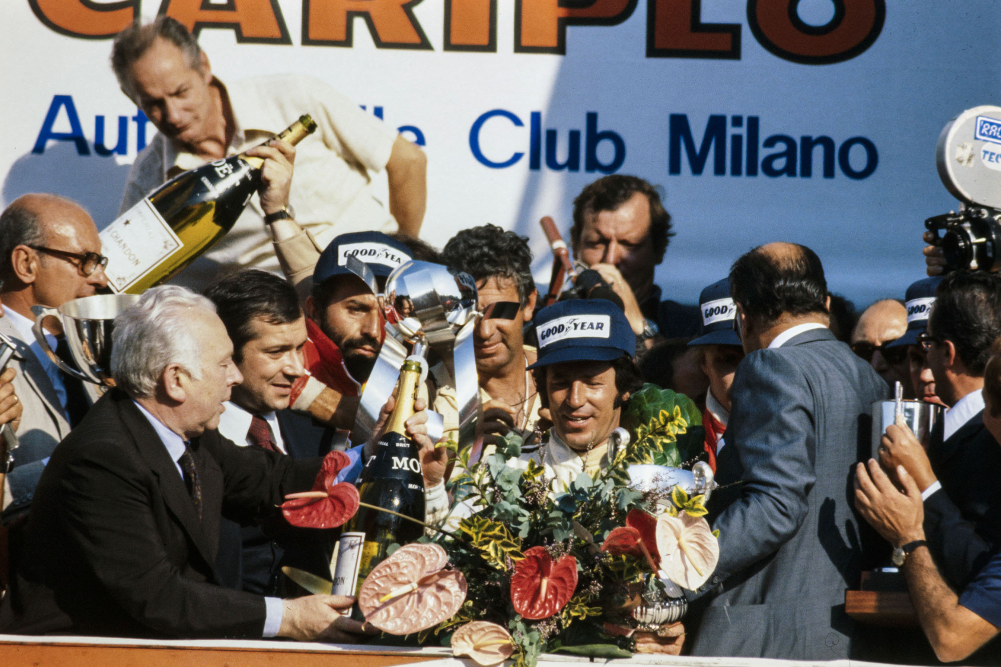 Mario Andretti (Lotus) celebrates winning the 1977 Italian Grand Prix, Monza.