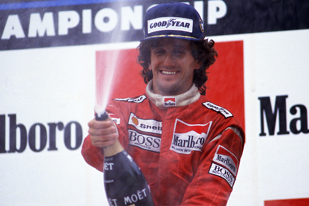 Race winner Alain Prost celebrates after equalling Jackie Stewarts record number of twenty-seven wins.