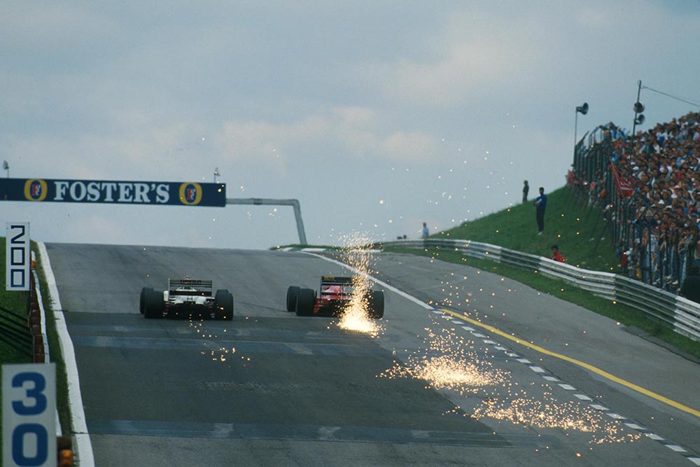 Cars bottom out going up the hill to Turn 1.