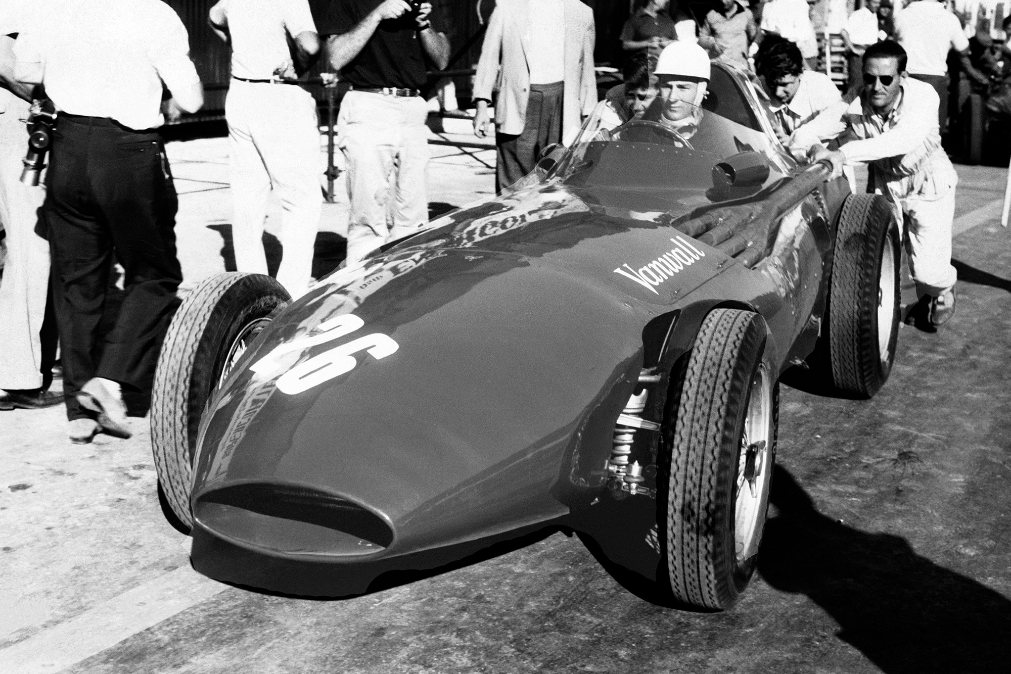Stirling Moss's Vanwall is pushed out of the pits during the 1957 Pescara Grand Prix