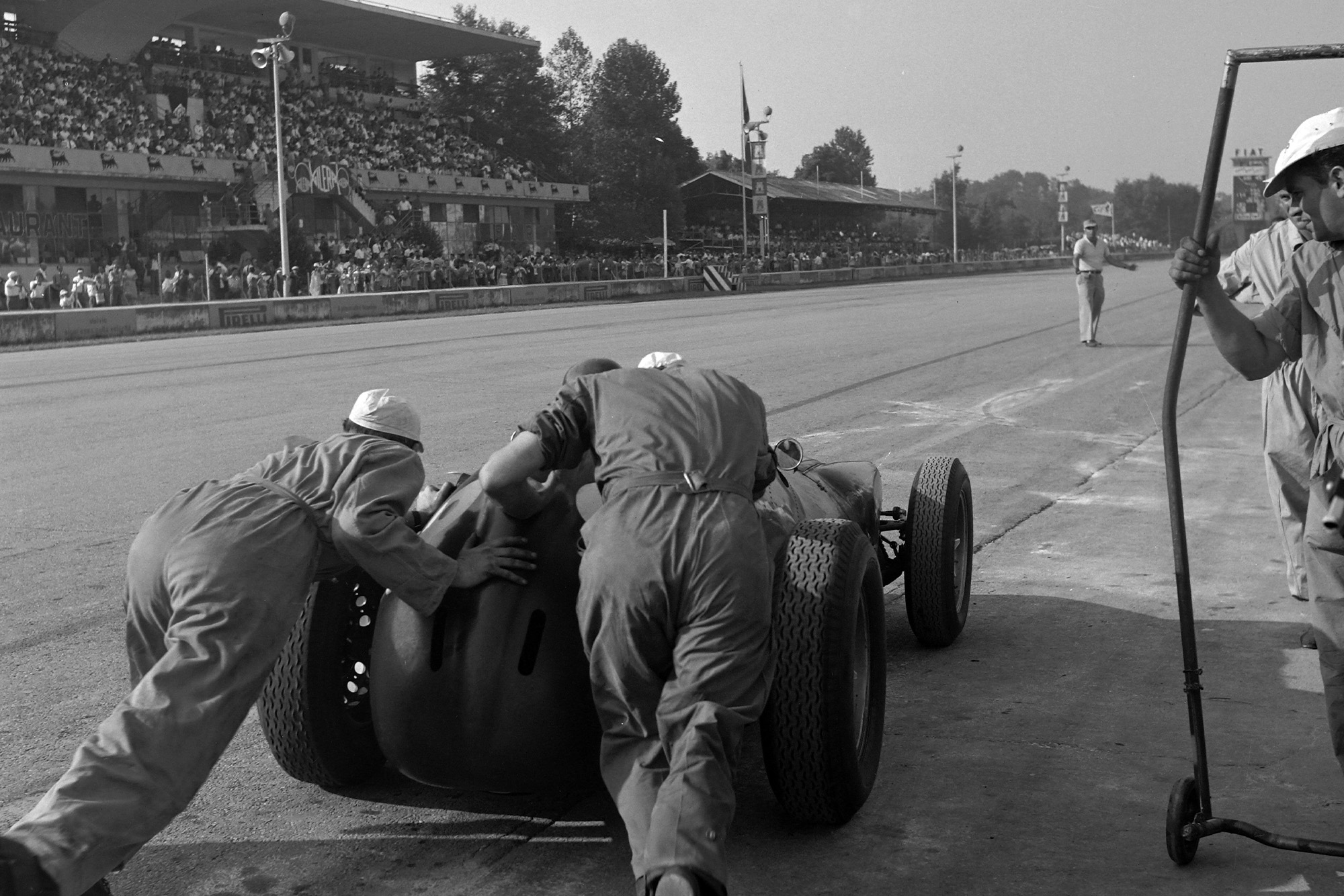 Behra gets a push out of the pits