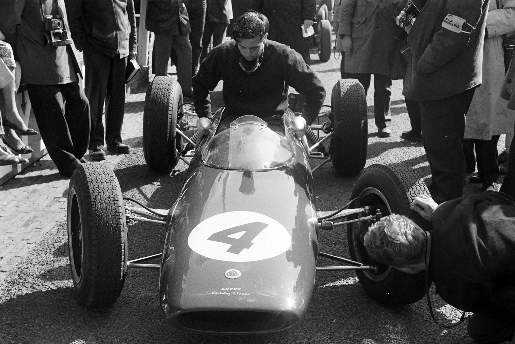 Jim Clark lowers himself into the new Lotus 25
