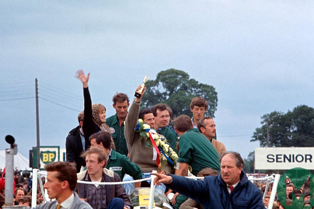 Jim Clark and Sally Swart on podium at 1963 British Grand Prix Silverstone