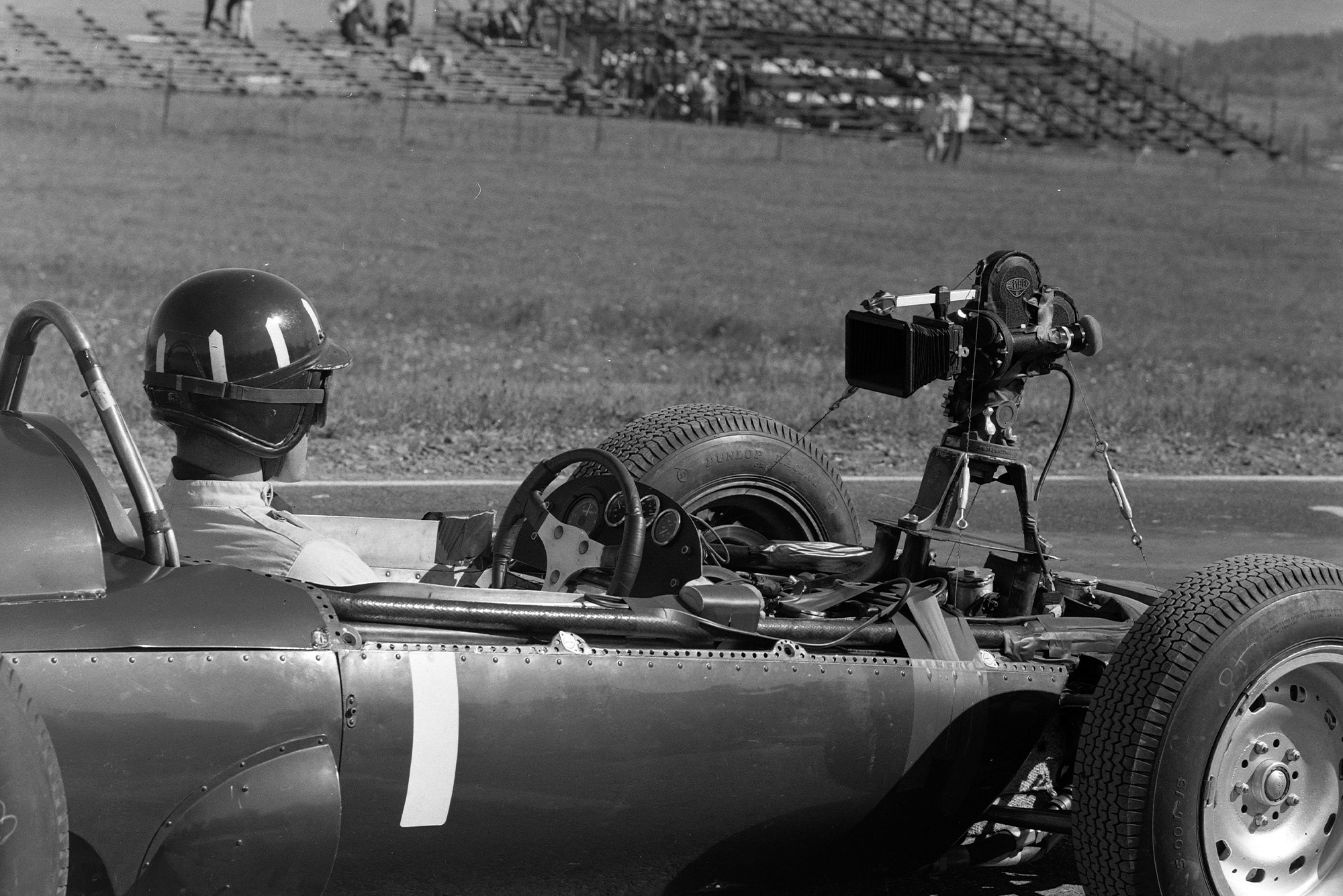 Graham Hill, BRM P57, with a rear-facing camera attached.