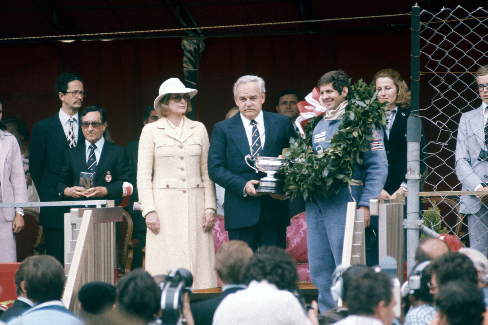 Jody Scheckter (Wolf) stands on the podium after winning the 1977 Monaco Grand Prix.