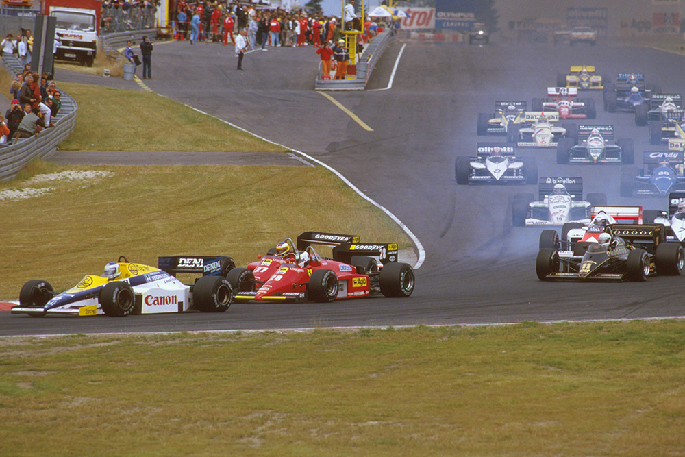 Keke Rosberg (Williams FW10 Honda) leads Stefan Johansson and Michele Alboreto (both Ferrari 156/85's) at the start. Senna has already gone through the shot.