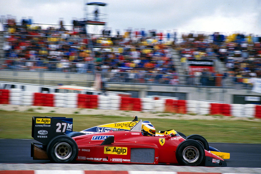 Race winner Michele Alboreto (Ferrari 156/85) overtakes Keke Rosberg (Williams Honda FW10).