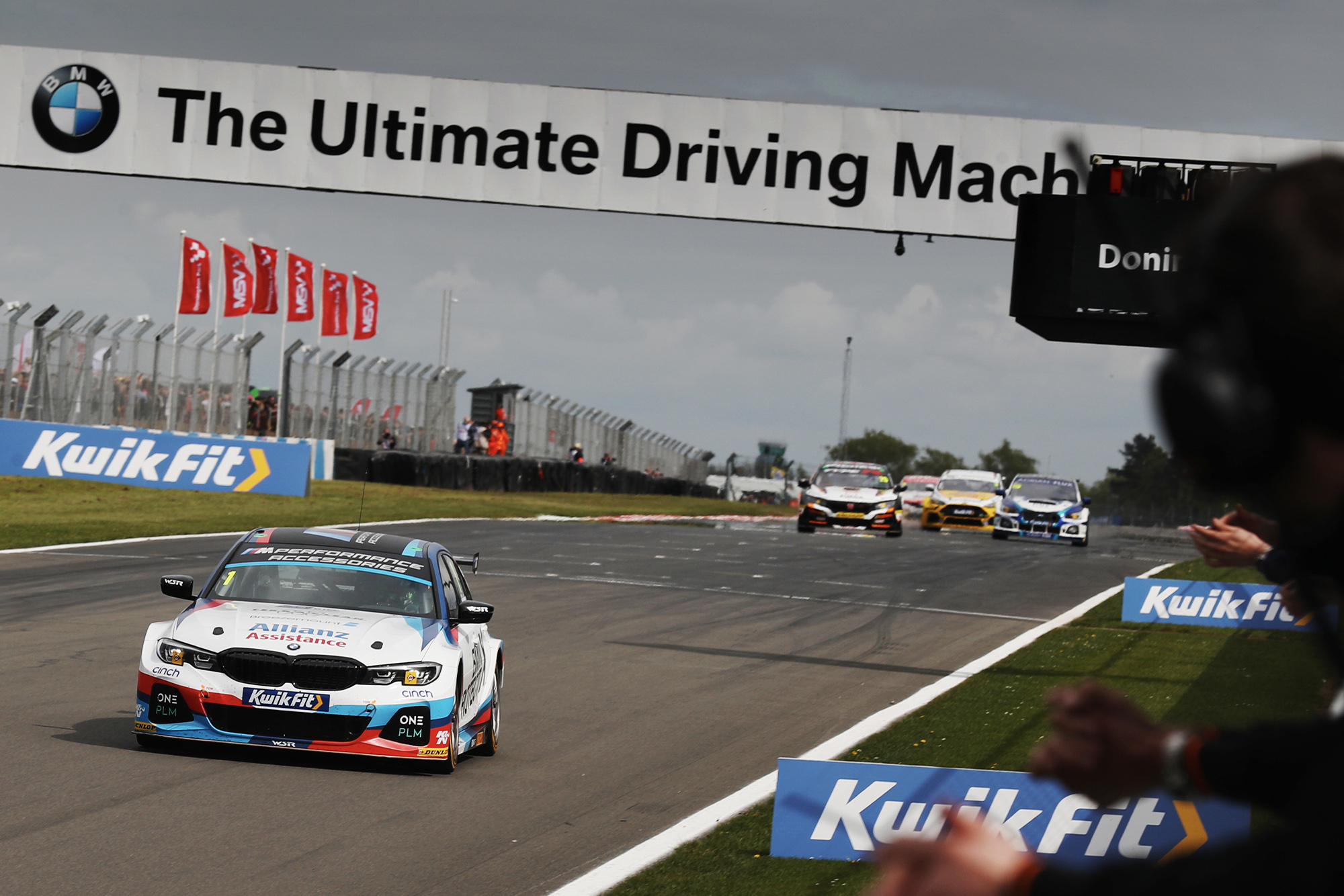 Colin Turkington leads at Donington Park early in the 2019 BTCC season