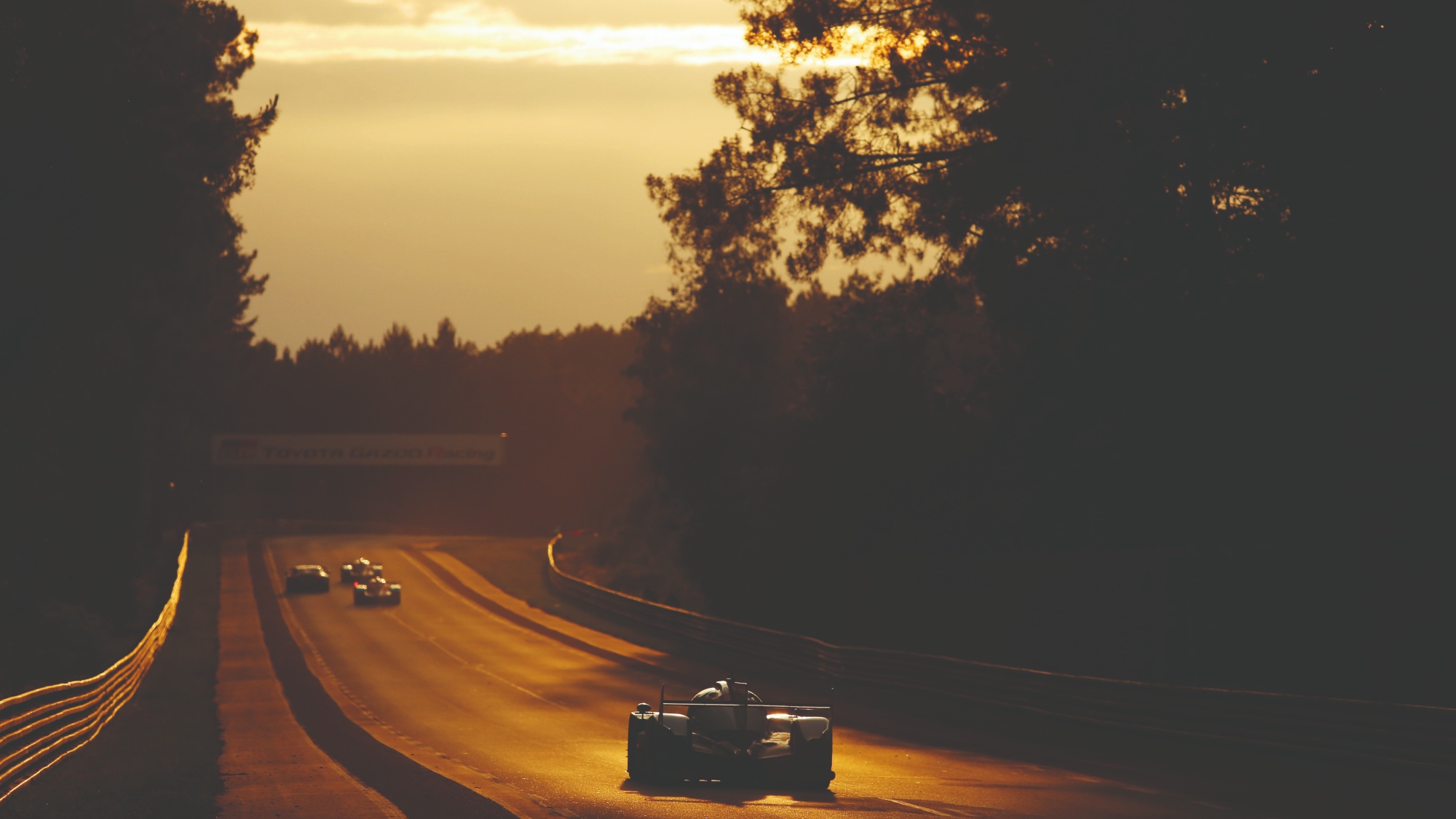 Cars head into the sunrise at the le Mans 24 Hours