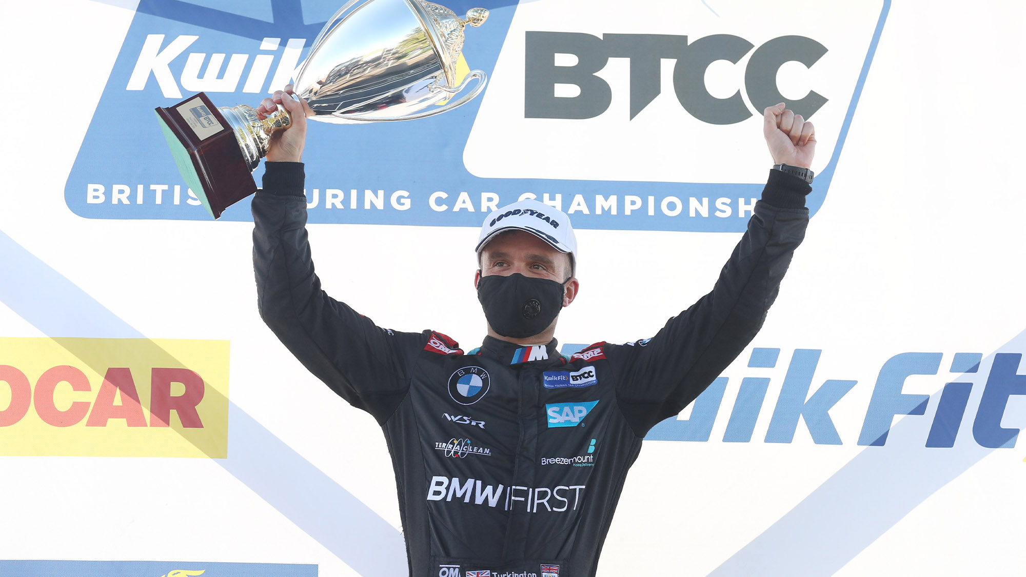 Colin Turkington celebrates victory at Snetterton on the BTCC podium in 2020