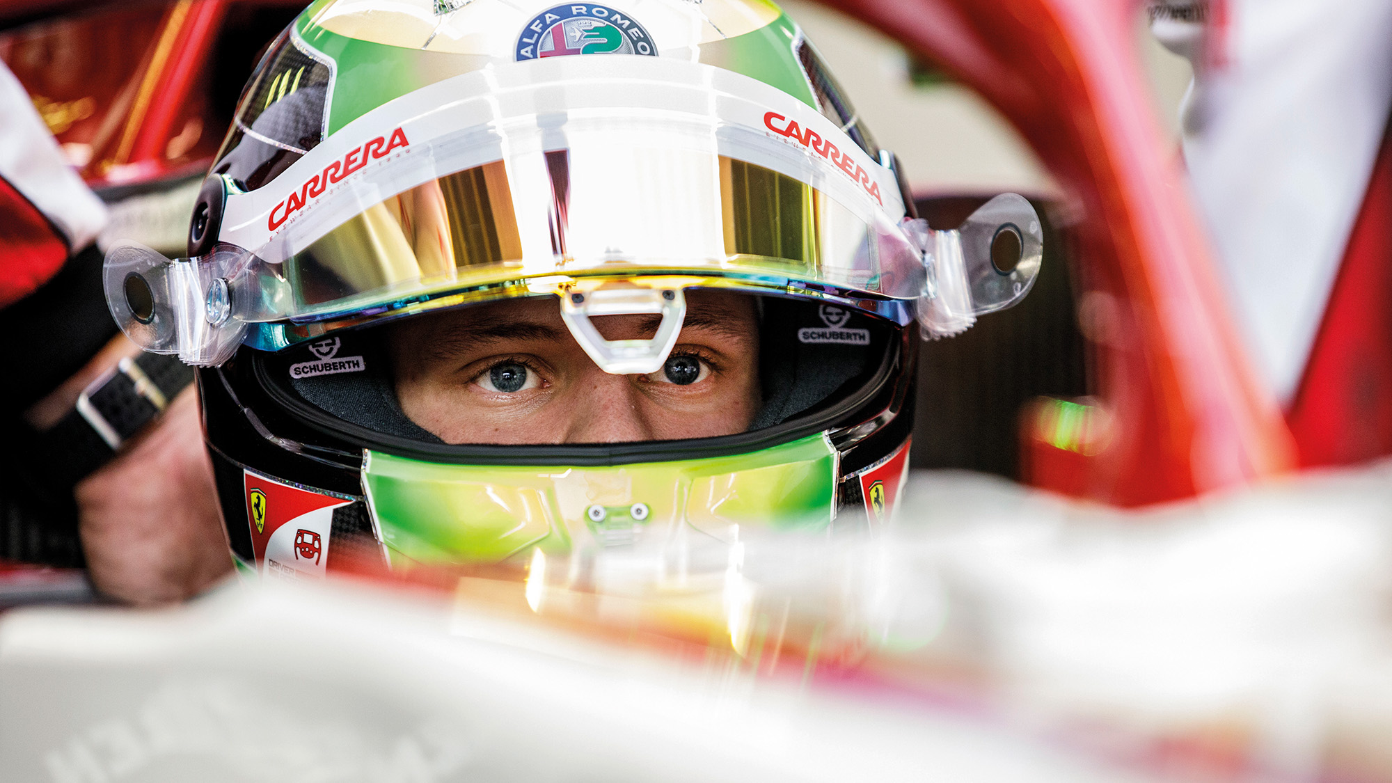 Mick Schumacher in the cockpit of a 2020 Alfa romeo F1 car