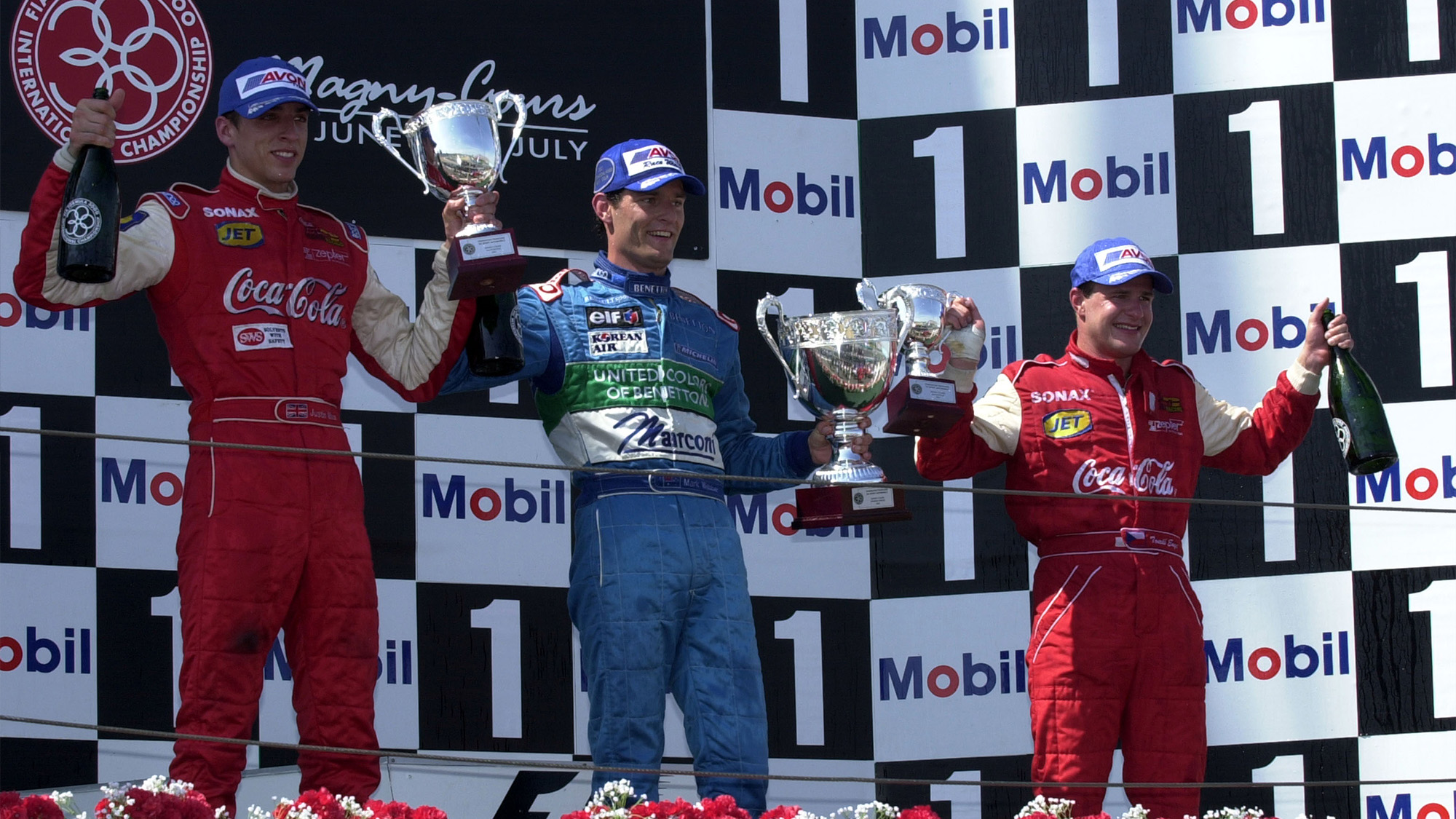 Justin Wilson Mark Webber and Tomas Enge on the podium at Magny Cours after the the 2001 F3000 race