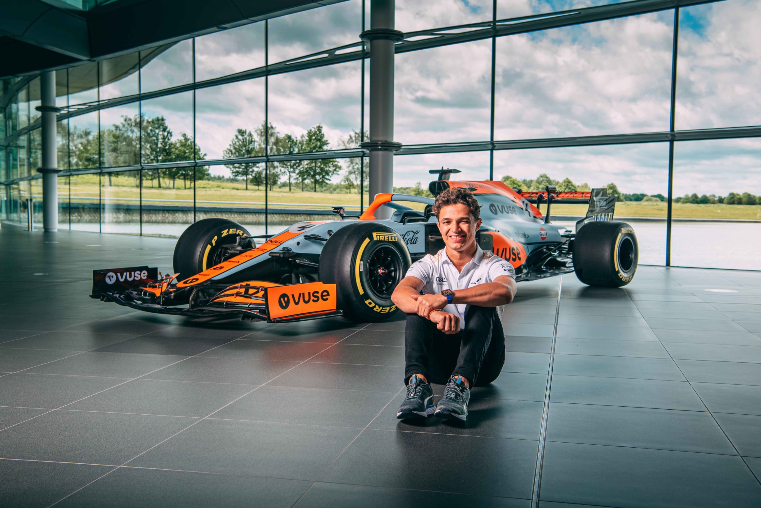 LKando Norris sitting ion front of McLaren